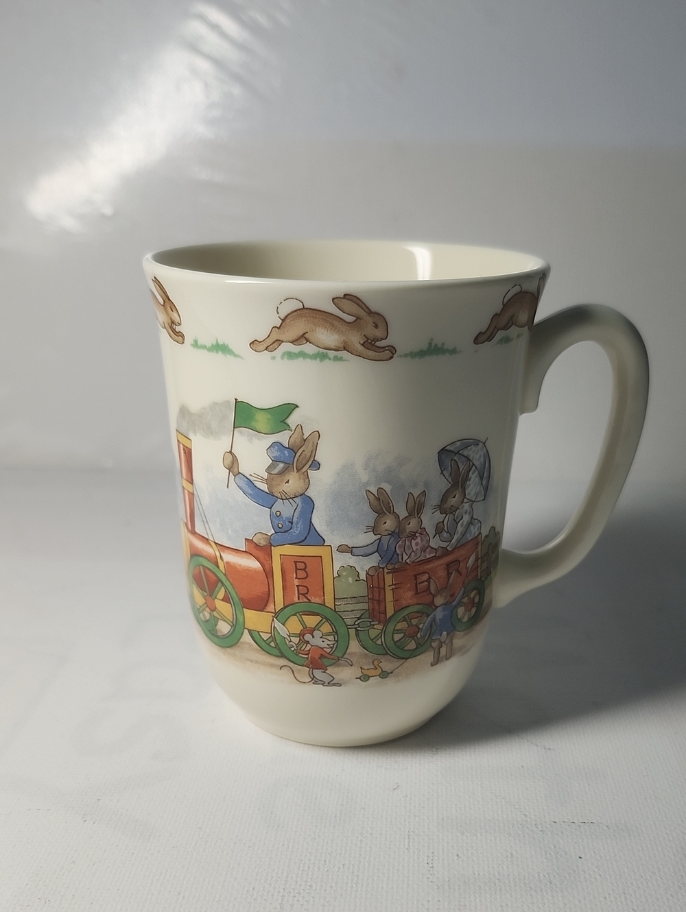 Royal Dourton Children's Bunny Train Mug in Cream with Green & Blue Accents